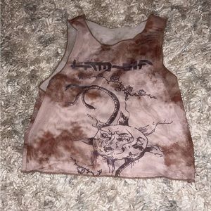 Brown mesh cropped top with graphic on it